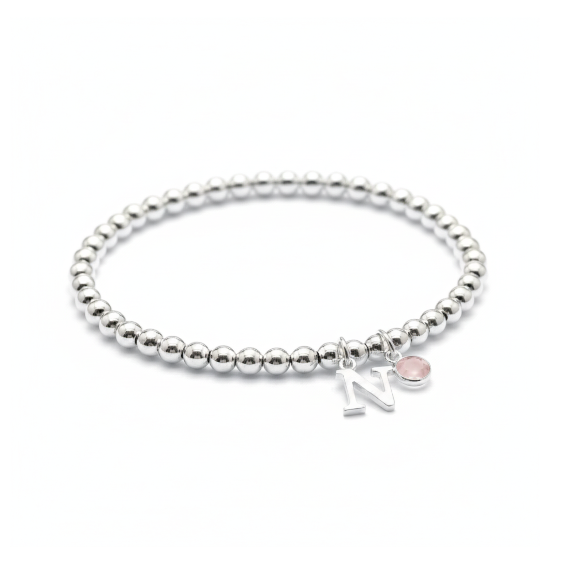 October birthstone and initial personalised bracelet with amethyst gemstone on a sterling silver stretch bracelet.