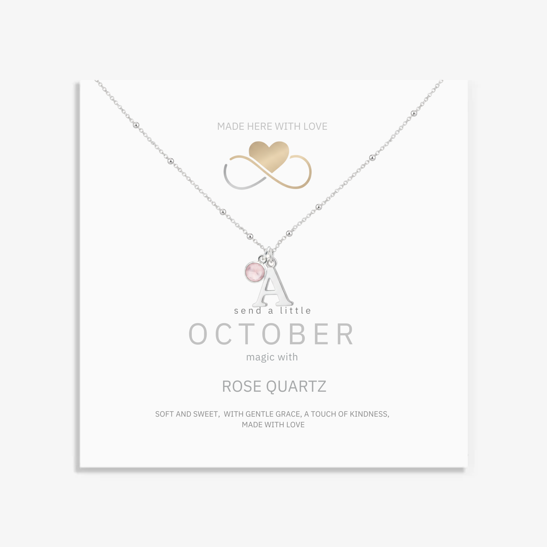 October birthstone personalised birthday necklace with rose quartz gemstone and sterling silver initial charm.