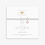 October birthstone necklace with rose quartz gemstone and initial letter charm in sterling silver, personalised jewellery gift.