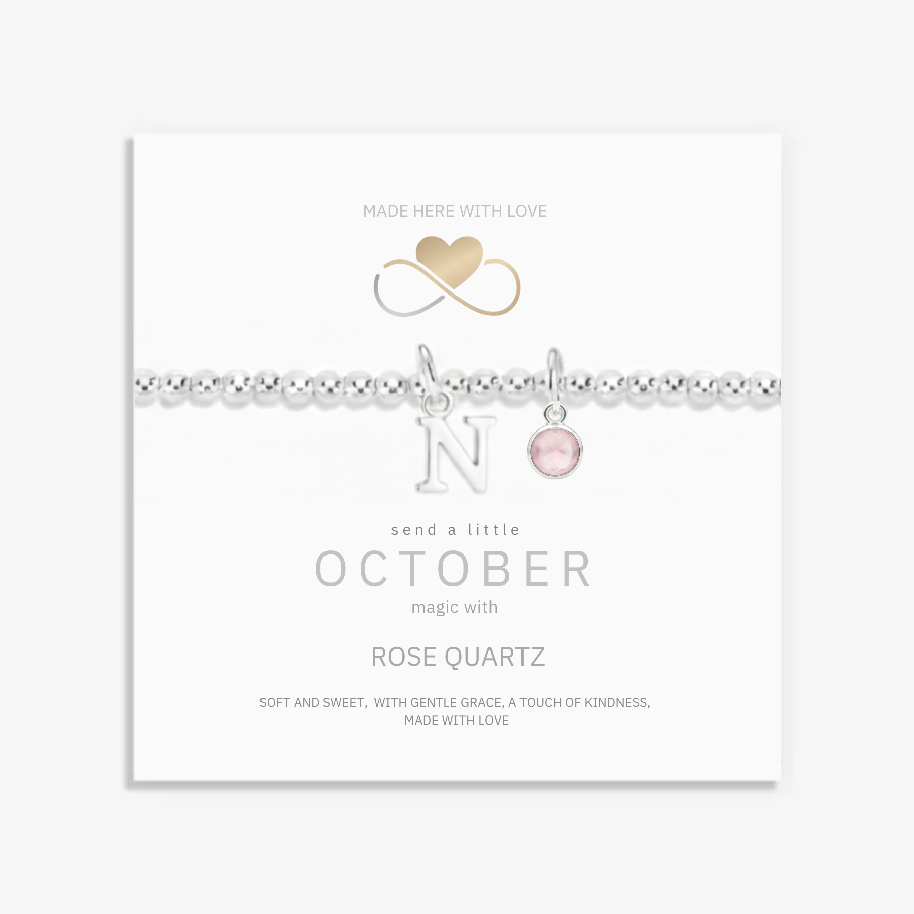 October birthstone necklace with rose quartz gemstone and initial letter charm in sterling silver, personalised jewellery gift.