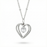 Sterling silver open heart pendant necklace with crystal bead detail on a fine chain.