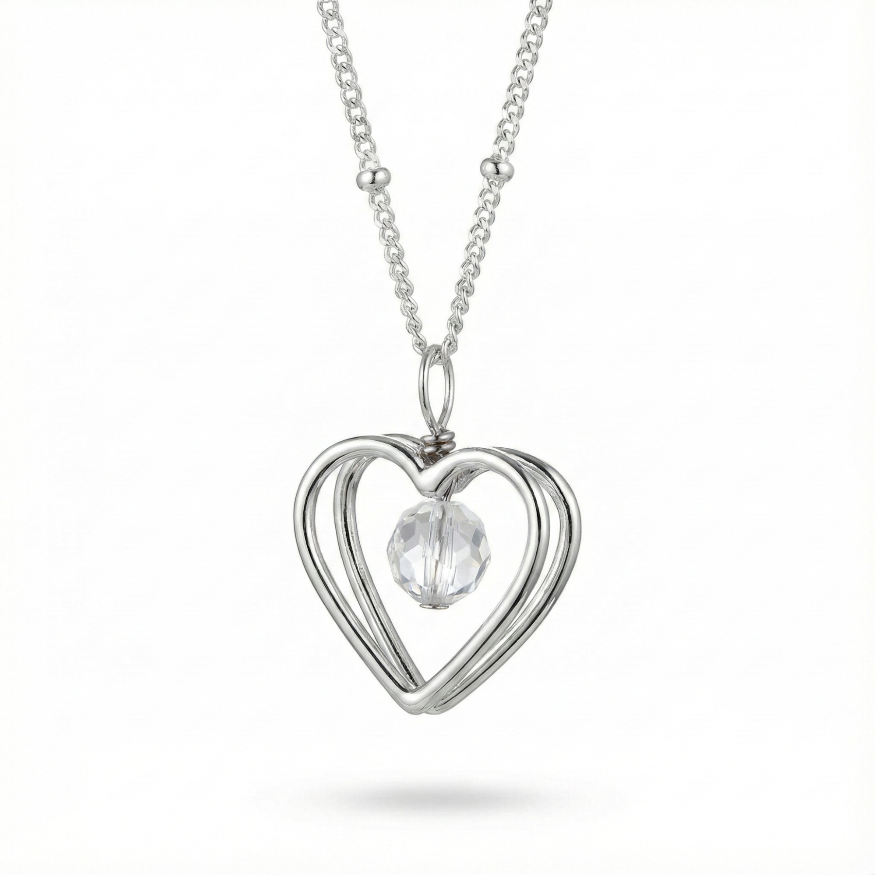 Sterling silver open heart pendant necklace with crystal bead detail on a fine chain.