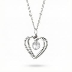 Sterling silver open heart pendant necklace with crystal bead detail on a fine chain.