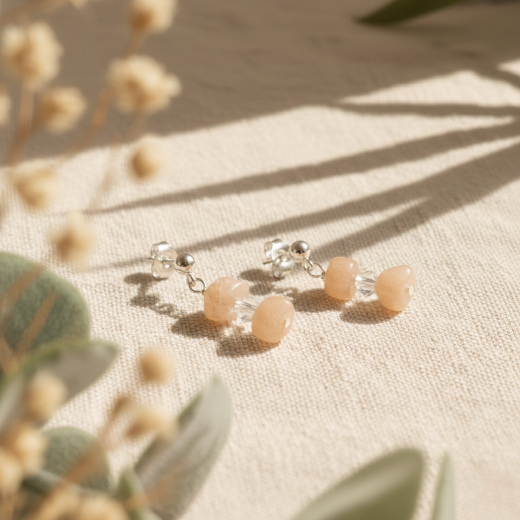 Peach moonstone gemstone earrings in sterling silver with warm blush tones, alternative June birthstone jewellery gift for her.