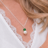 close up of Freshwater pearl and emerald crystal wire wrap pendant necklace in sterling silver - May birthstone necklace handmade in the UK by Made Here with Love
