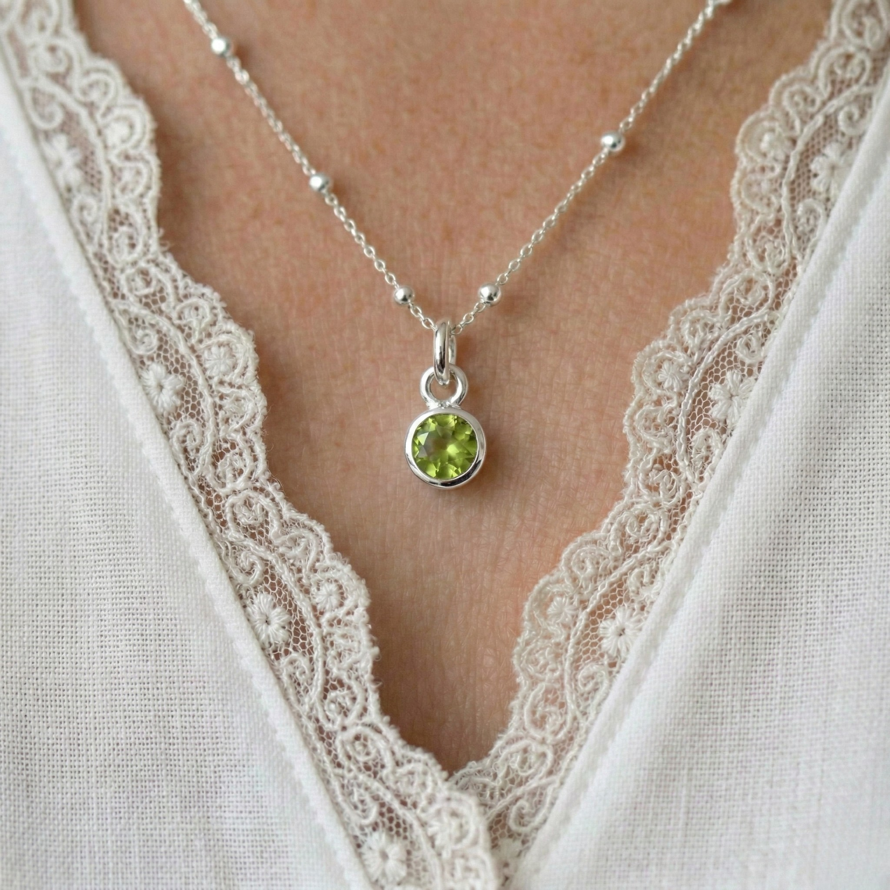 Peridot charm necklace in sterling silver, August birthstone pendant UK