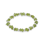 Peridot crystal bead bracelet with faceted green gemstones and sterling silver beads on a stretch design.
