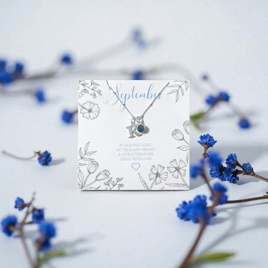 Personalised September birthstone necklace with sapphire charm and silver initial pendant, handmade meaningful jewellery gift for women UK by Made Here With Love.