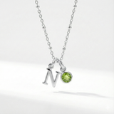 Personalised August birthstone necklace with peridot gemstone charm on a sterling silver chain.