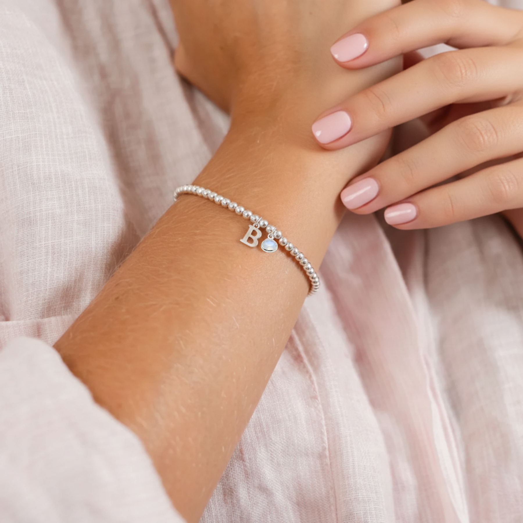 Personalised June moonstone birthstone bracelet with initial charm, delicate sterling silver jewellery gift