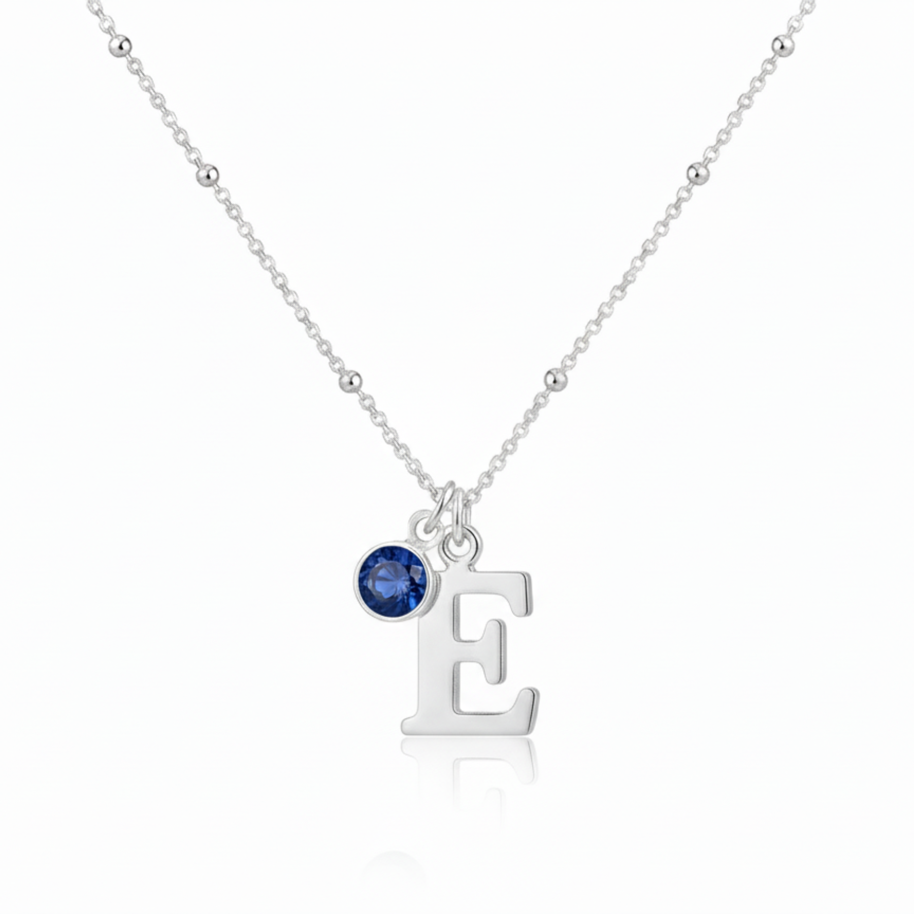 Personalised initial and September sapphire necklace in sterling silver, meaningful birthstone jewellery gift for her.