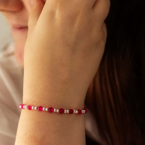 Pink stone bracelet with elegant charm