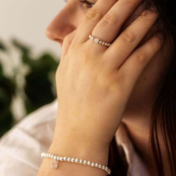 Rose Quartz Gemstone Ring with silver beads and rose quartz stone styled on hand with matching bracelet