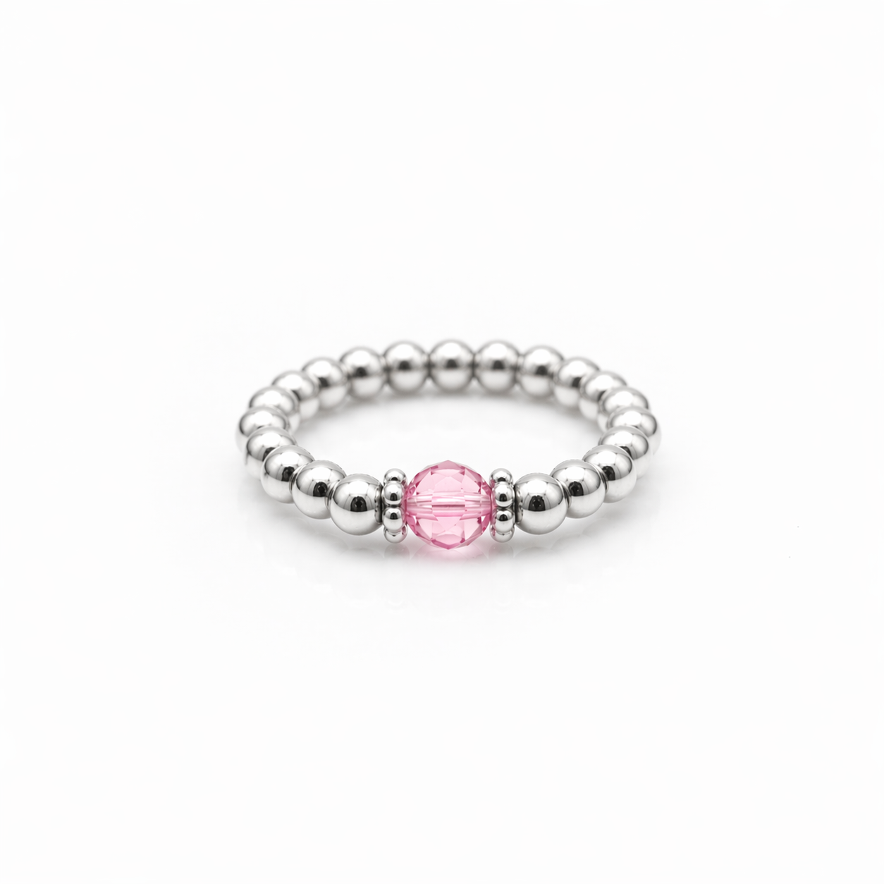 rose crystal ring with a faceted pink gemstone set on a sterling silver bead ring.