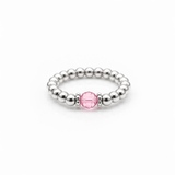 rose crystal ring with a faceted pink gemstone set on a sterling silver bead ring.