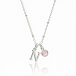 Rose quartz and initial letter charm necklace in sterling silver, personalised October birthstone jewellery for her.