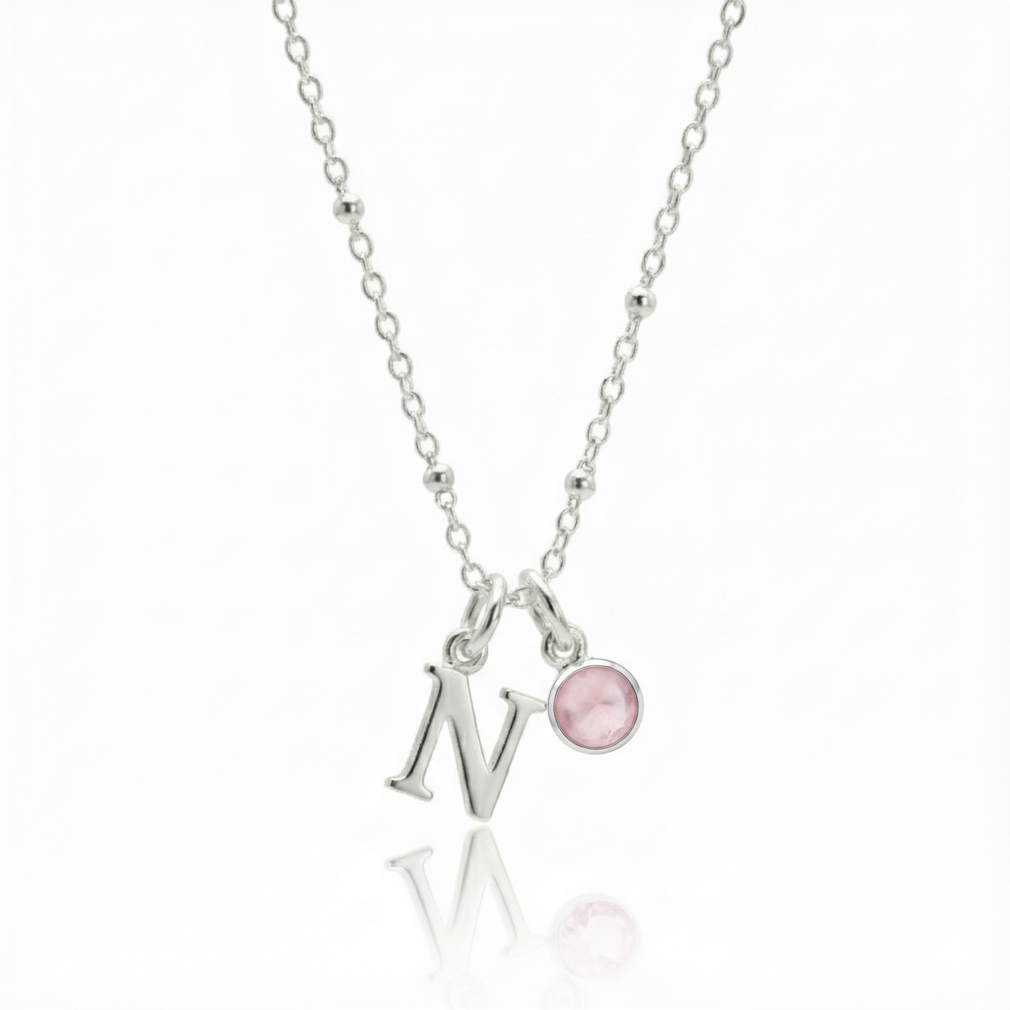 Rose quartz and initial letter charm necklace in sterling silver, personalised October birthstone jewellery for her.