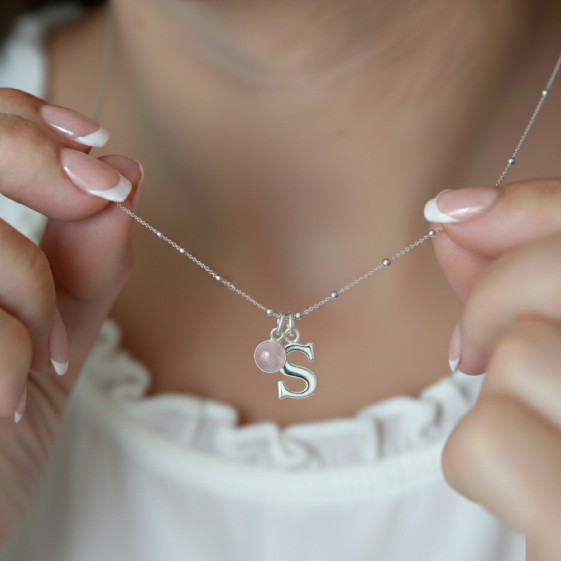 Rose quartz and initial letter personalised birthstone necklace in sterling silver, October birthday jewellery gift.