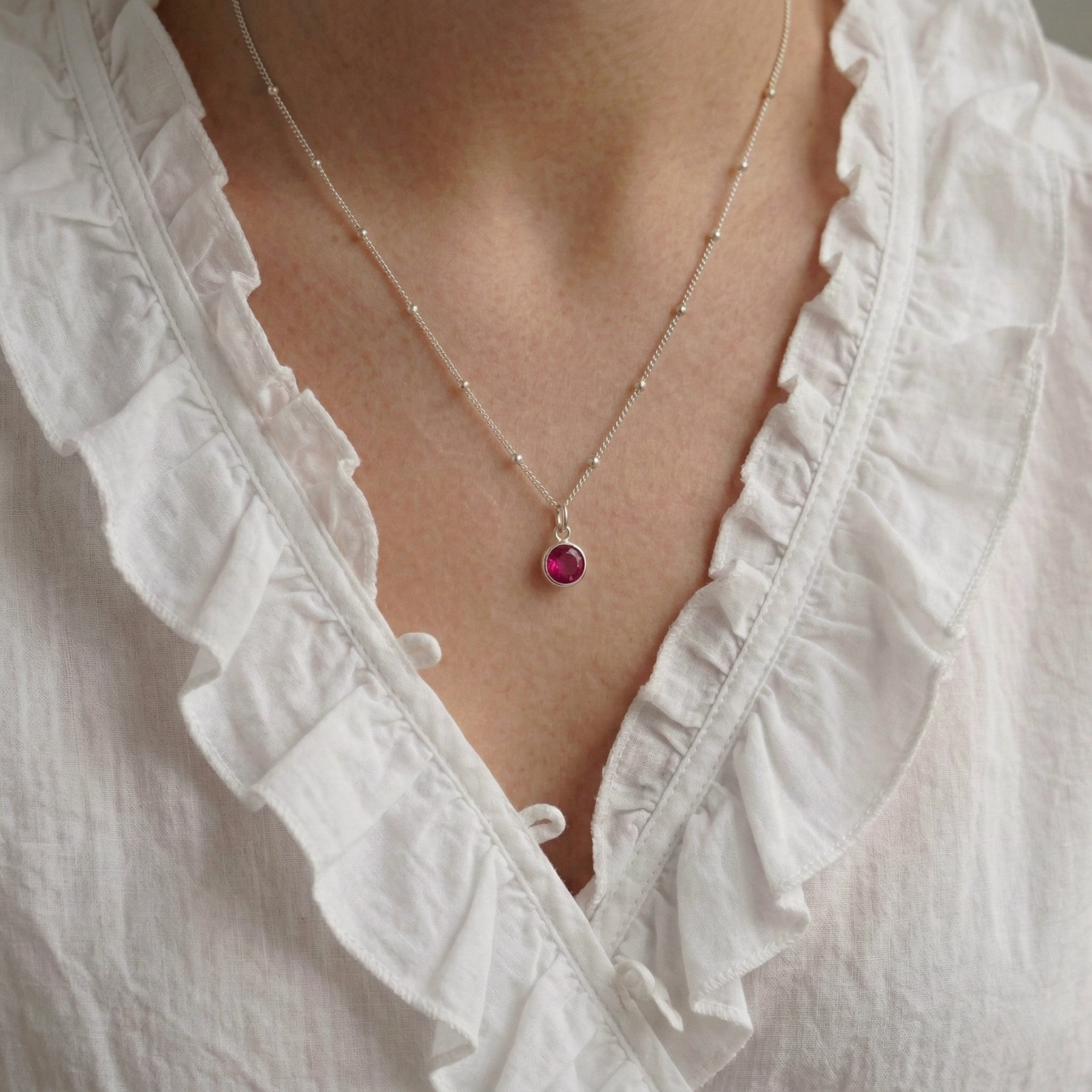 Ruby charm necklace for July birthstone, sterling silver jewellery UK