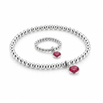 July ruby birthstone jewellery set featuring a sterling silver charm bracelet with pinky red details.