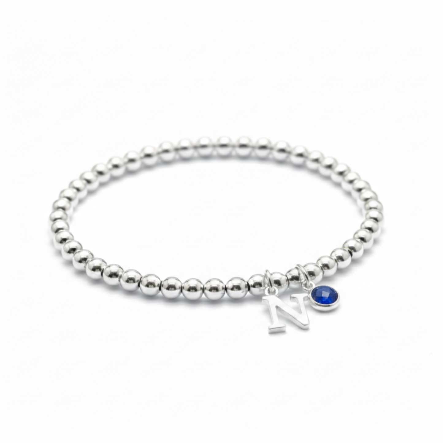 Sapphire and initial charm bracelet in sterling silver, September birthstone personalised gift for her.