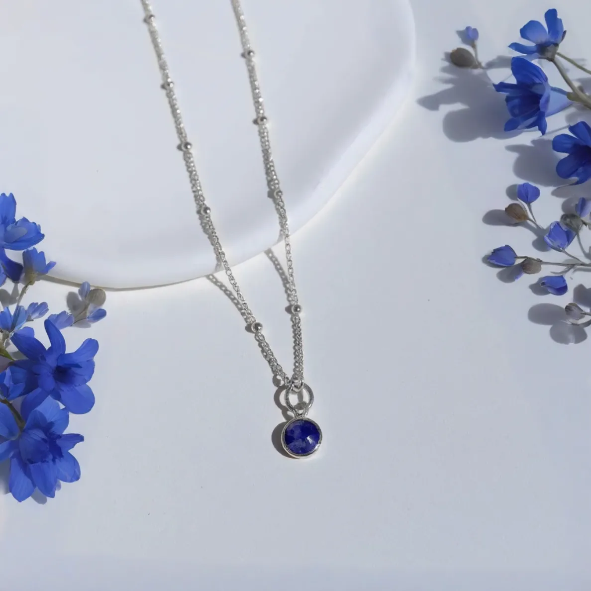 September birthstone necklace with sapphire gemstone pendant on sterling silver chain, handmade meaningful jewellery gift for women UK by Made Here With Love.