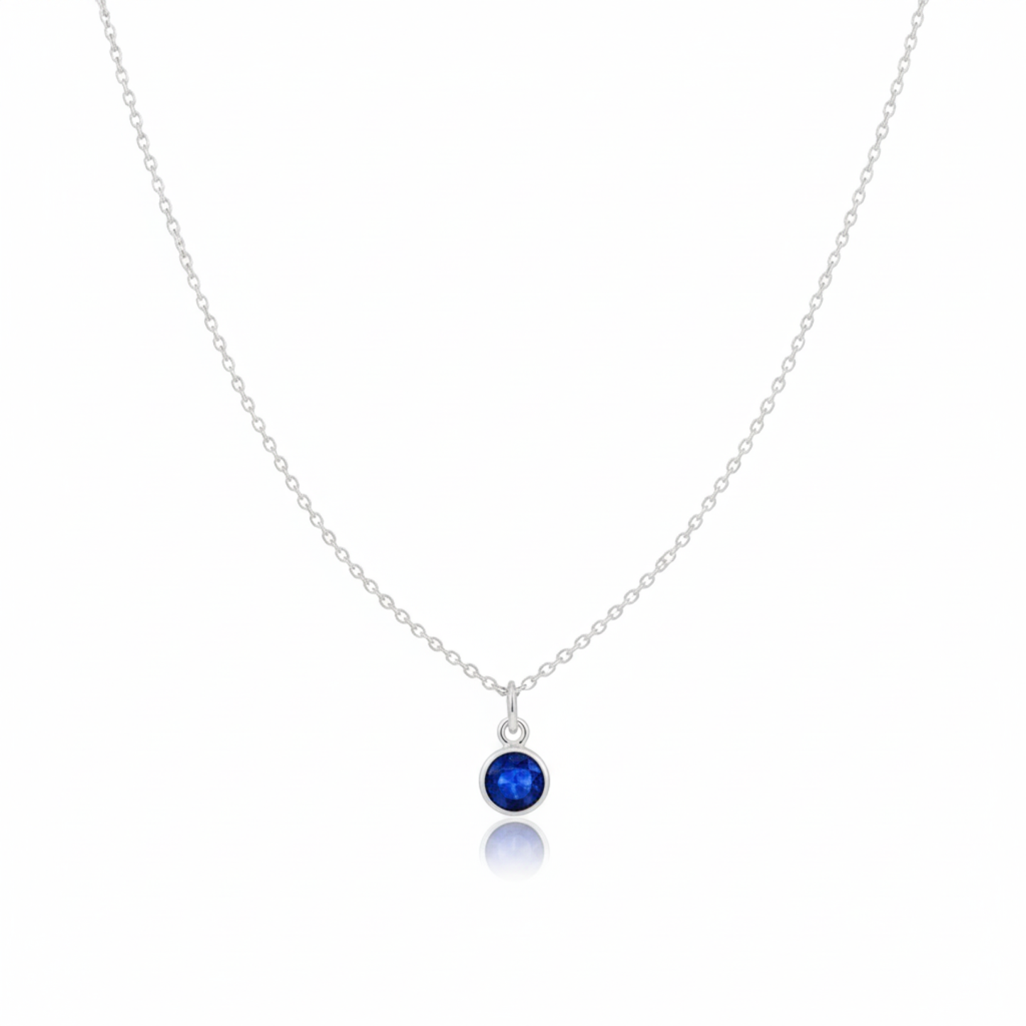 Sapphire charm necklace featuring September birthstone gemstone