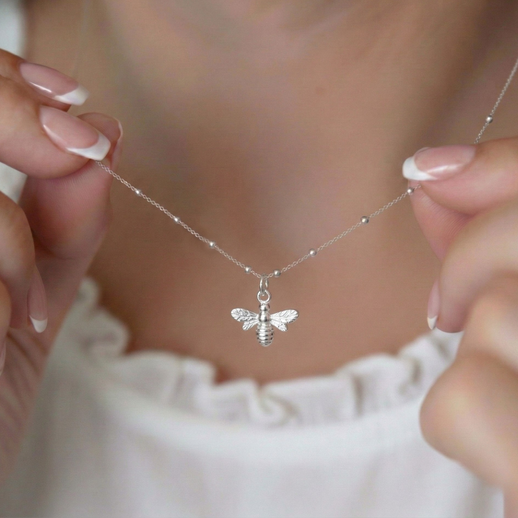 Sterling silver bee charm necklace on delicate chain, nature inspired jewellery UK