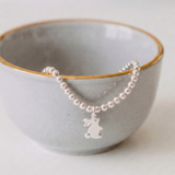 Sterling silver bunny charm bracelet with stretch bead design, handmade jewellery UK