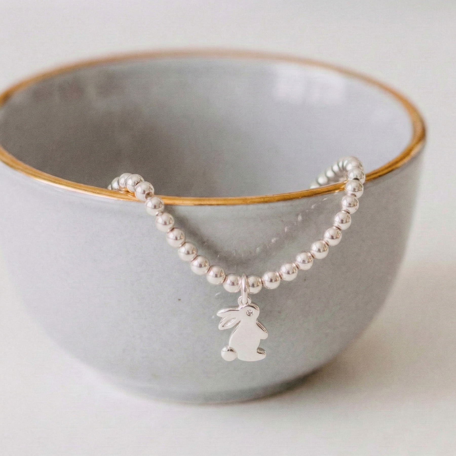 Sterling silver bunny charm bracelet with stretch bead design, handmade jewellery UK