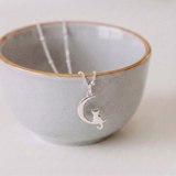 Silver cat charm necklace with moon detail, handmade animal jewellery UK