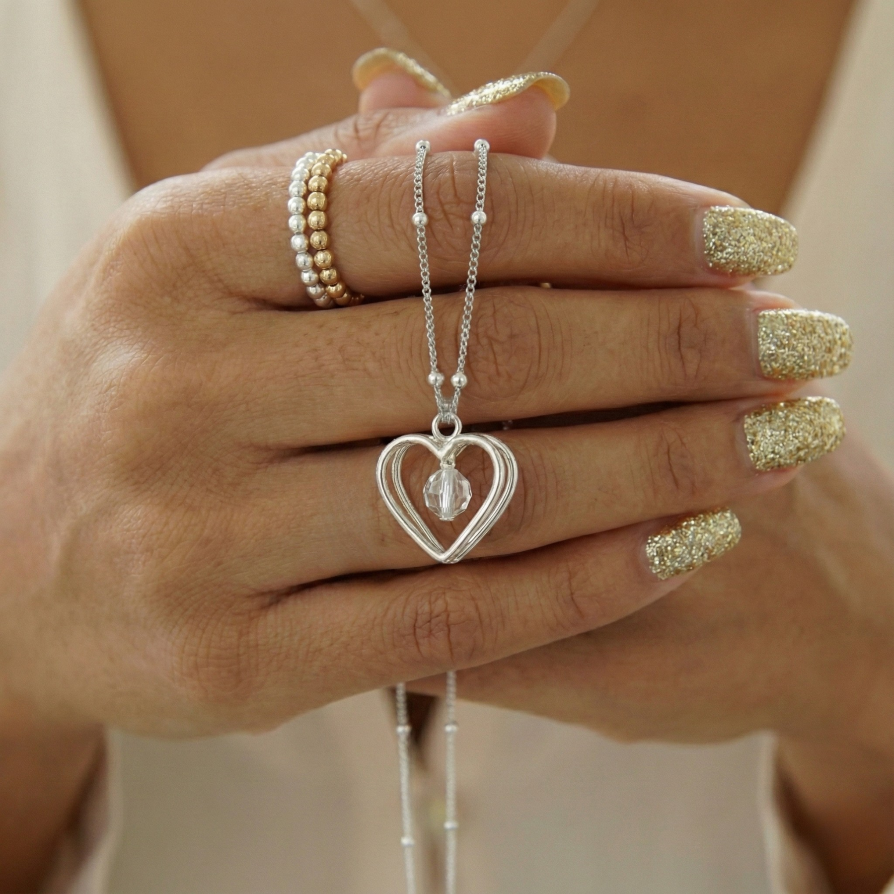 Sterling silver heart necklace featuring a crystal bead charm on a fine chain.