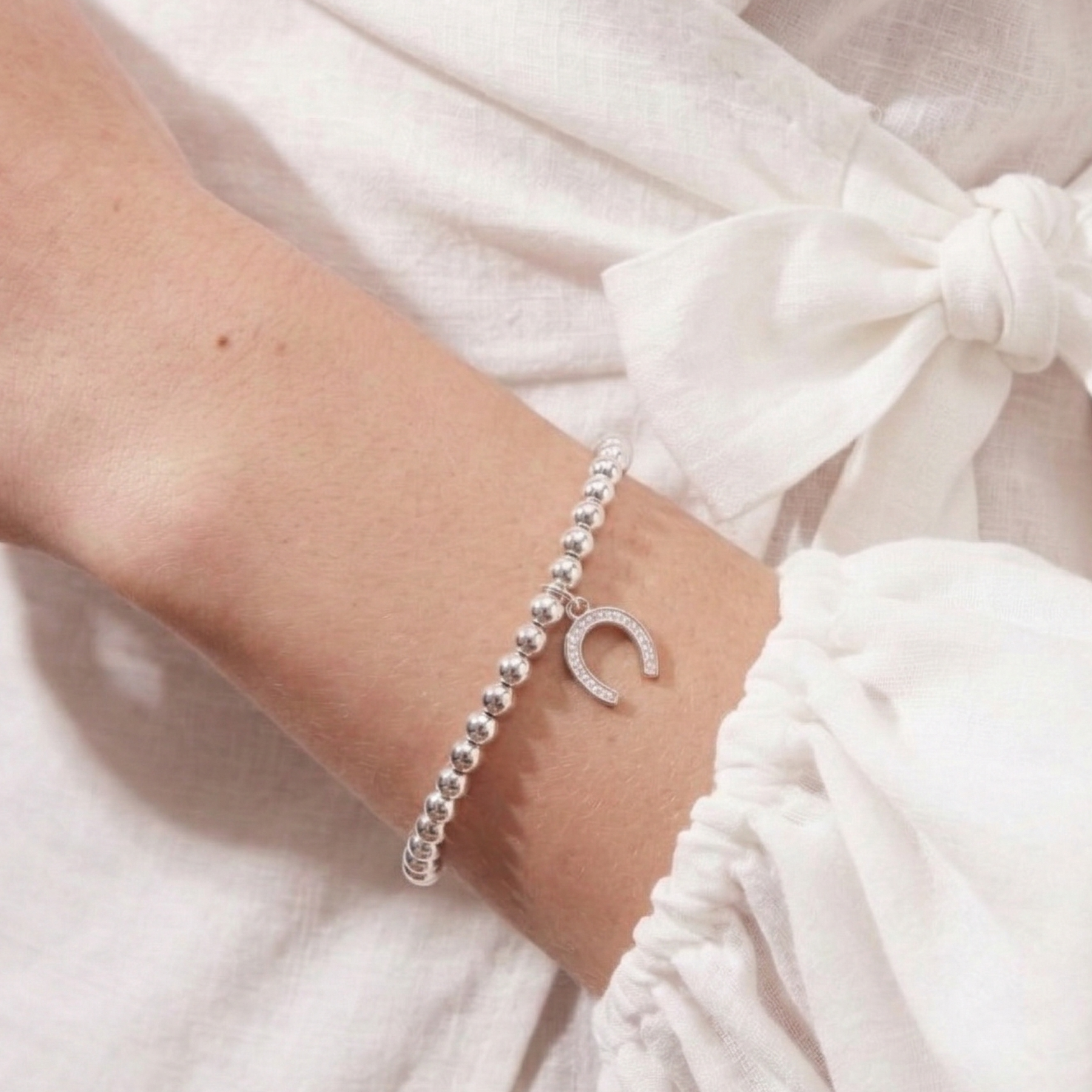 Silver horseshoe charm bracelet in sterling silver, good luck jewellery gift UK
