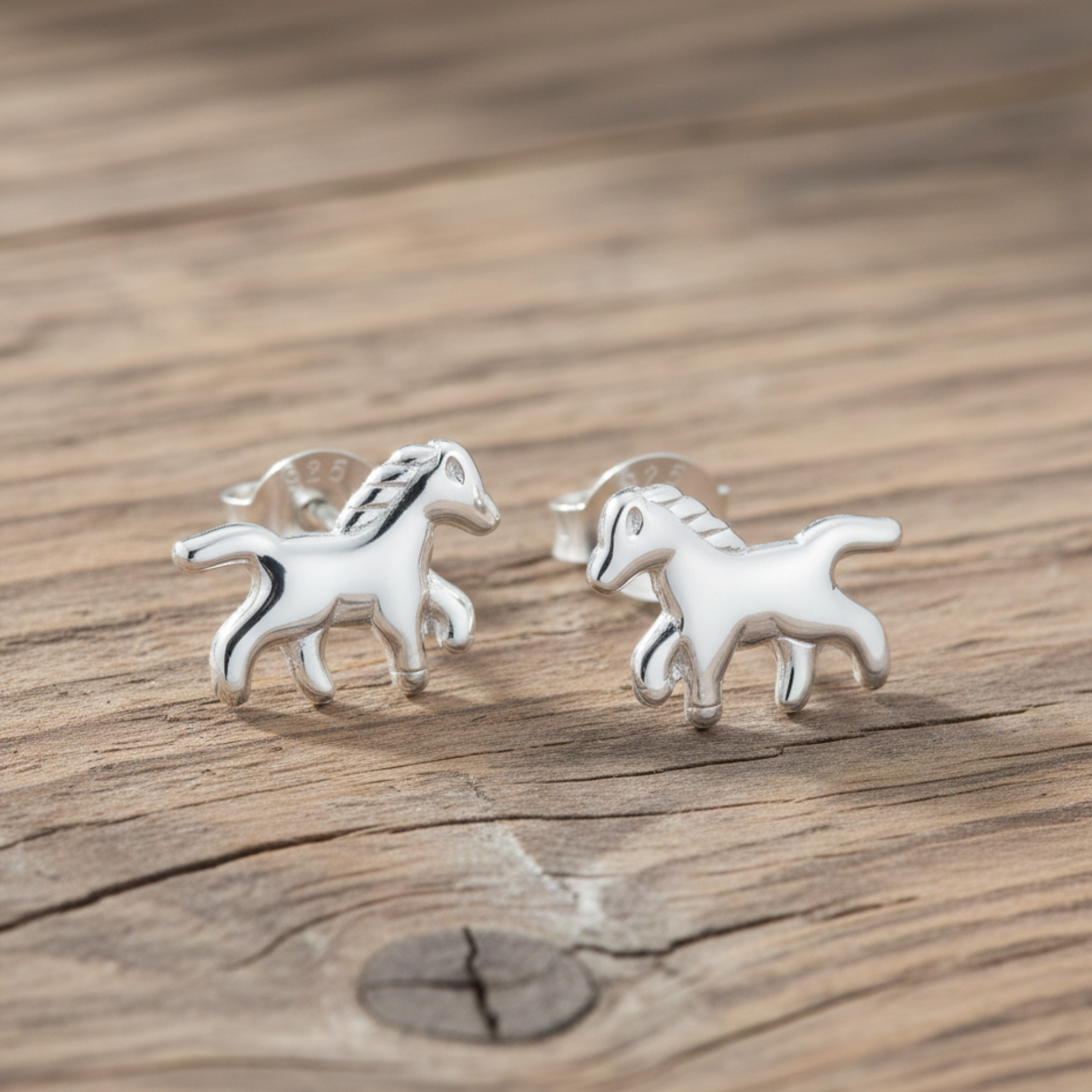Sterling silver horse studs with graceful galloping horse design, equestrian jewellery gift for horse enthusiasts.