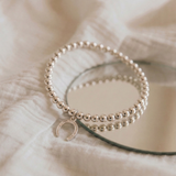 Silver horseshoe charm bracelet, stretch bead bracelet for everyday wear UK