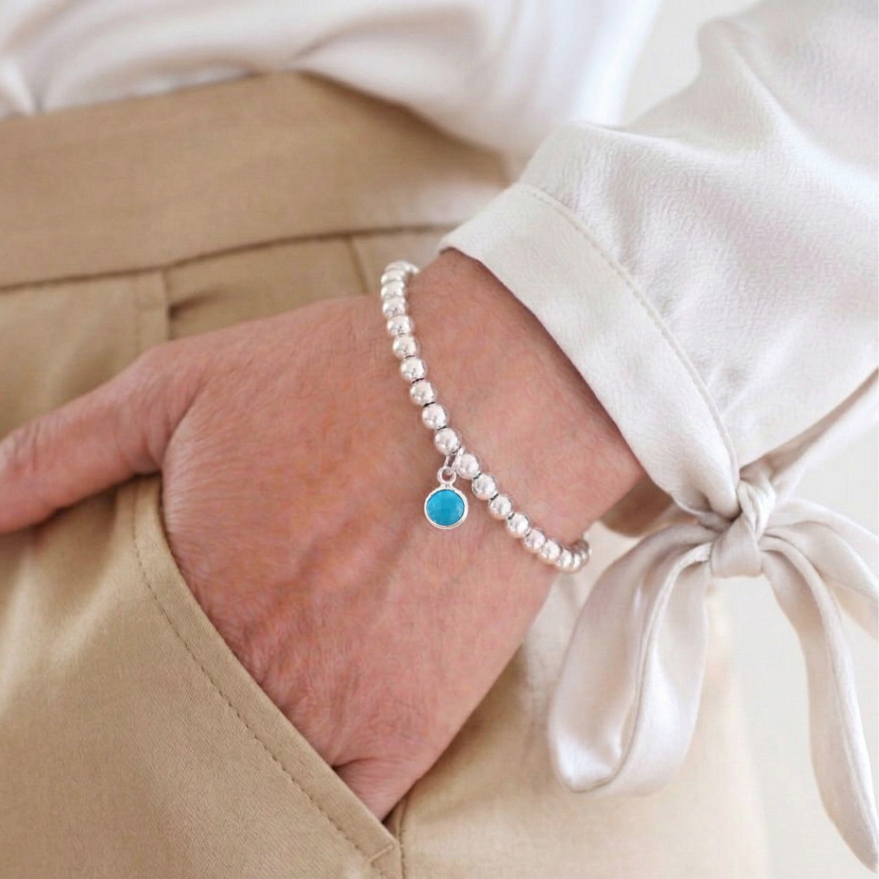 Turquoise charm bracelet handmade with sterling silver beads, gemstone stretch bracelet UK